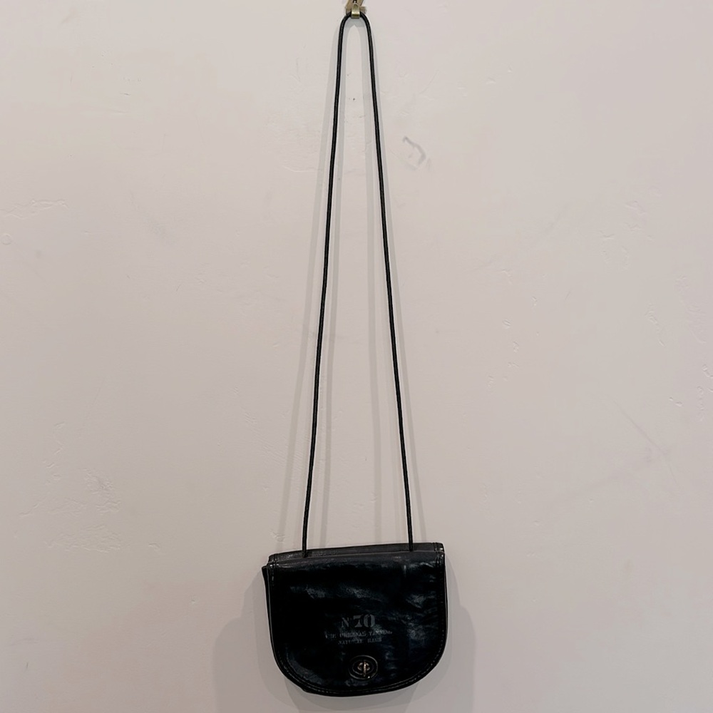 This Fred Segal crossbody bag has zip dollar side & zip coin side for travel!